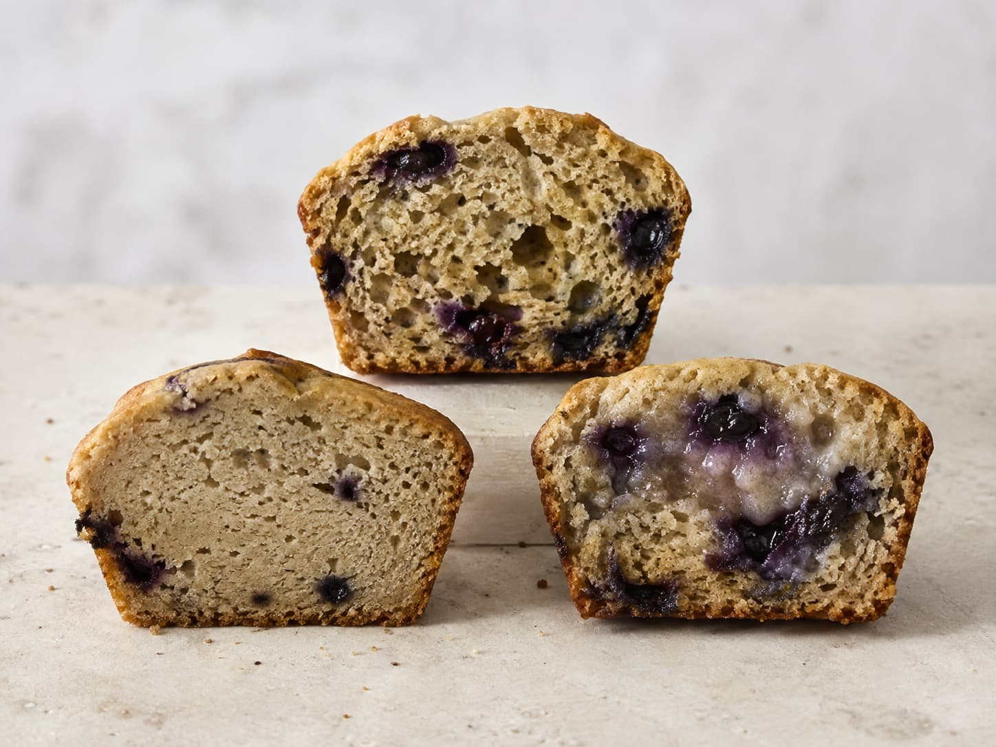 Banana blueberry muffin crumb examples showing different density and moisture levels