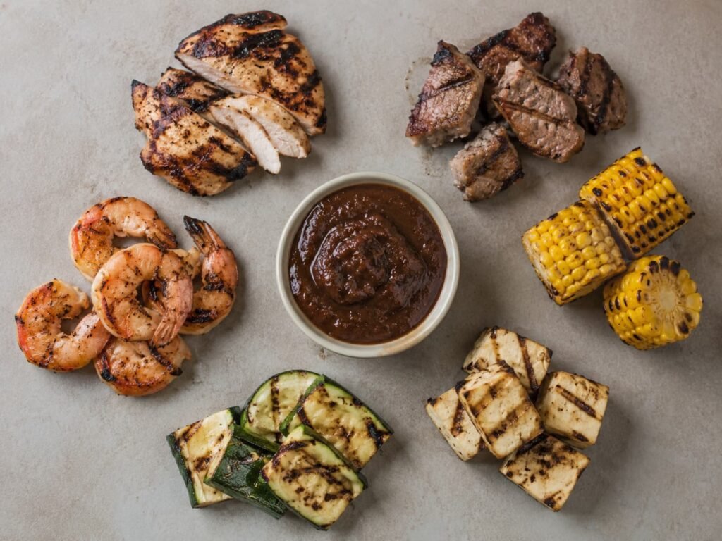Chicken, pork, shrimp, vegetables, and tofu shown as possible jerk BBQ sauce pairings