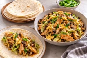 Moo shu-style chicken filling with vegetables, egg, and flour tortillas