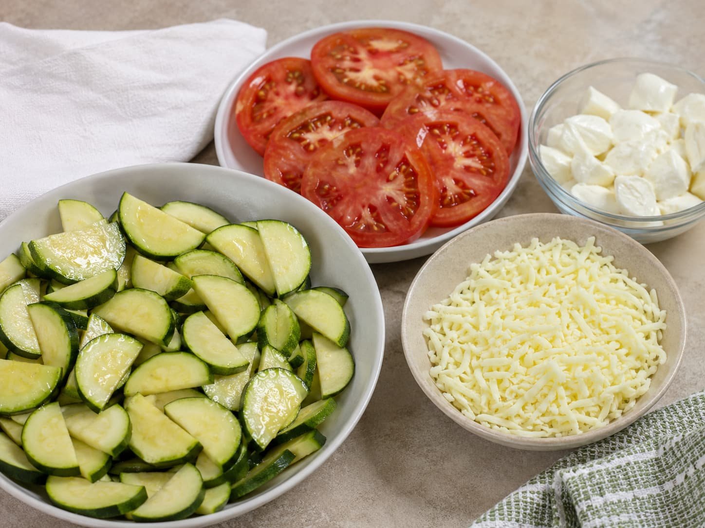 Zucchini, tomatoes, fresh mozzarella, and lower-moisture mozzarella shown as moisture considerations