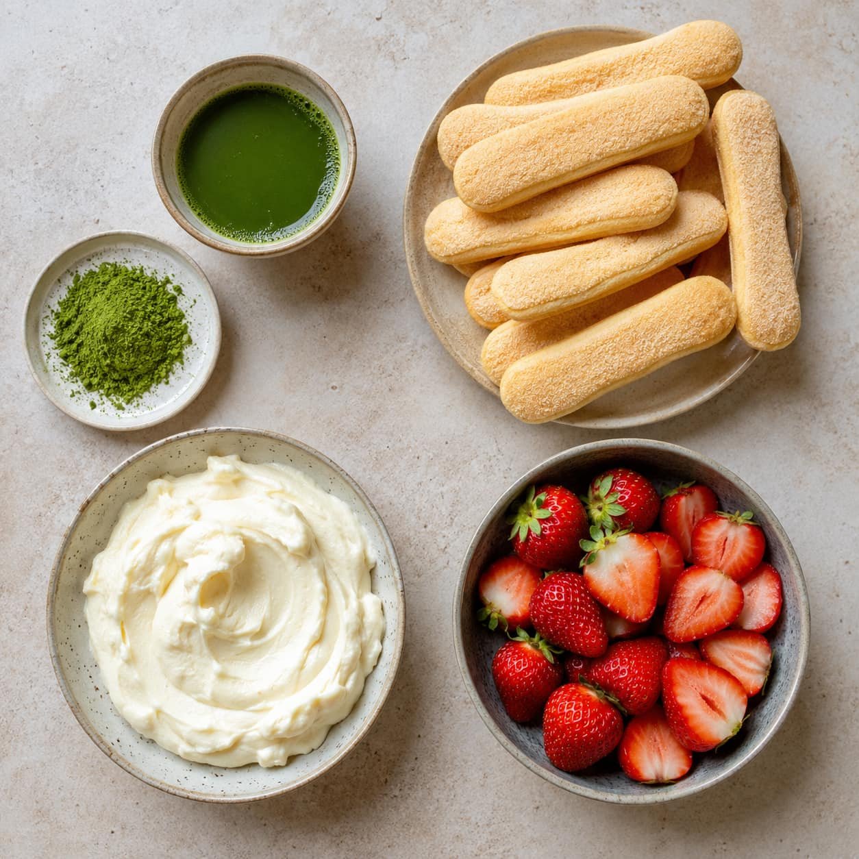 Matcha, ladyfingers, mascarpone cream, and strawberries used in strawberry matcha tiramisu